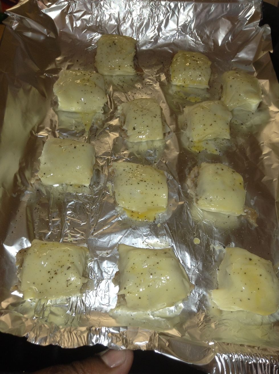 Place on baking tray, cover in eggs wash, and sprinkle black pepper on the top. Bake for 20-25mins