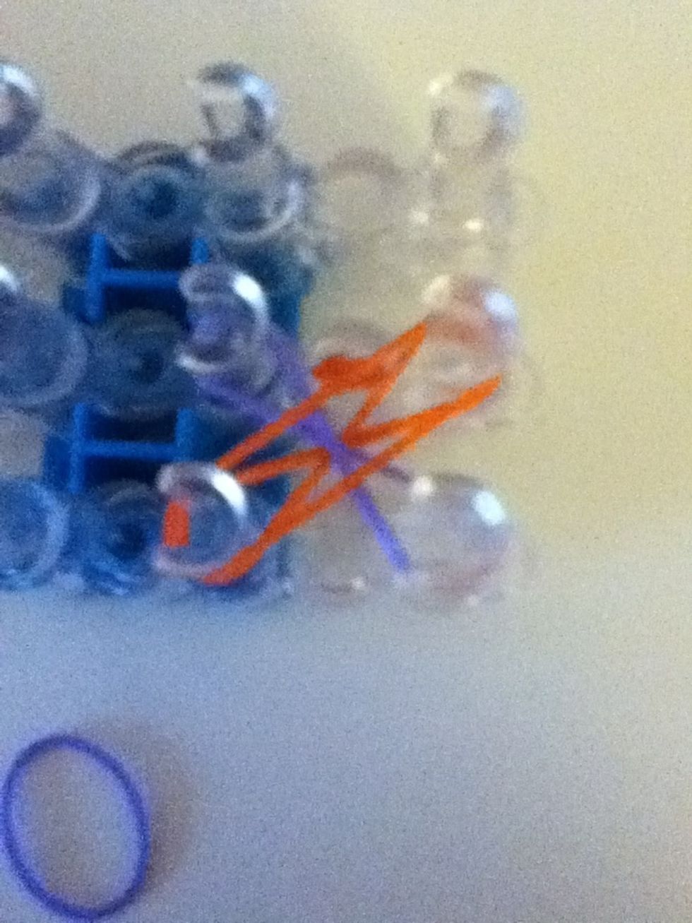 Place one band across the first band you placed