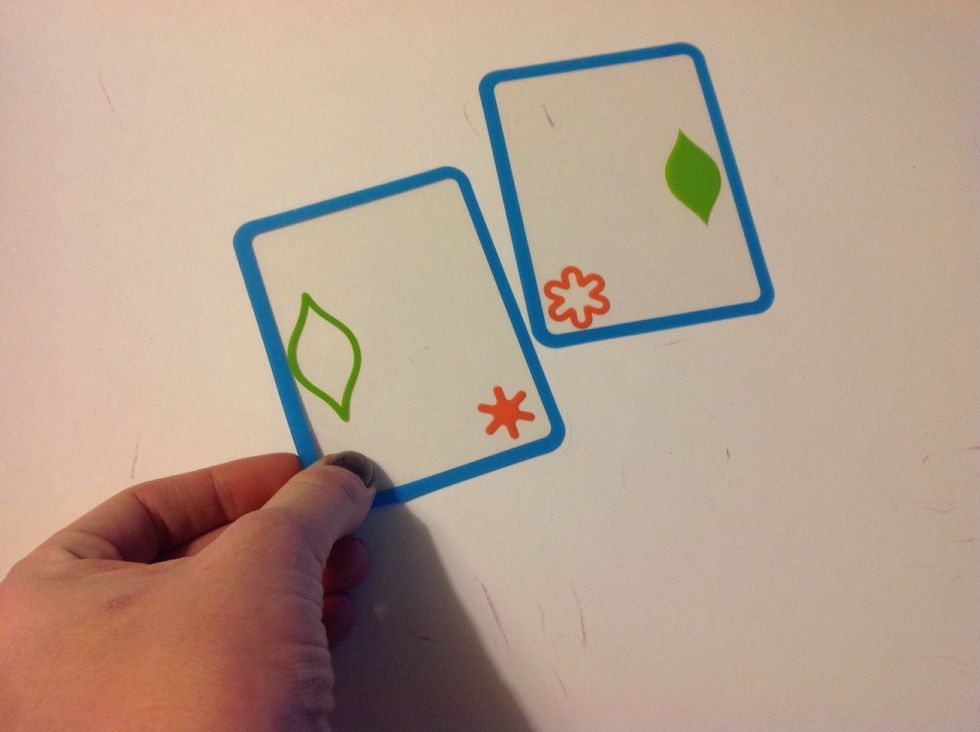 Place one card on the table. Hand the student a second card in a position that requires them to turn the card over in order to make the match. Continue as described on previous steps.
