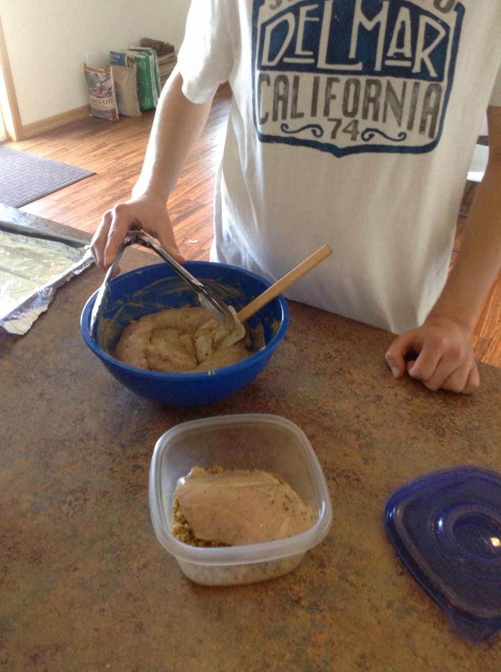 Place one chicken breast at a time into Tupperware
