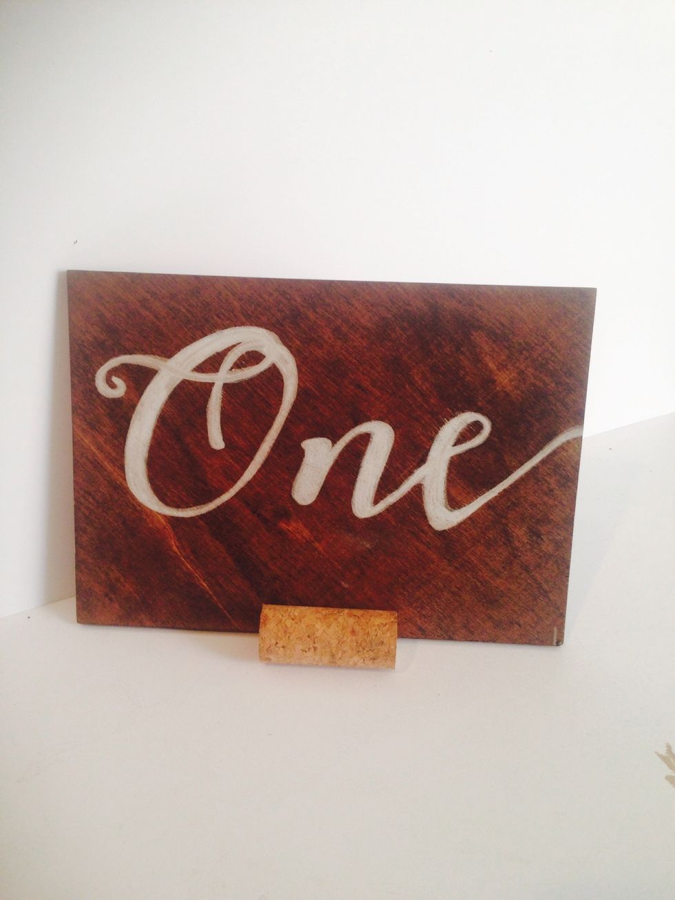 Place one cork in the front bottom and the other on the back to create a stand