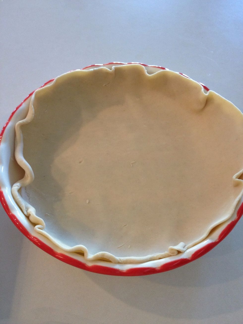 Place one crust in a traditional pie pan. Mine has beveled edges, but it's OK if yours is flat.