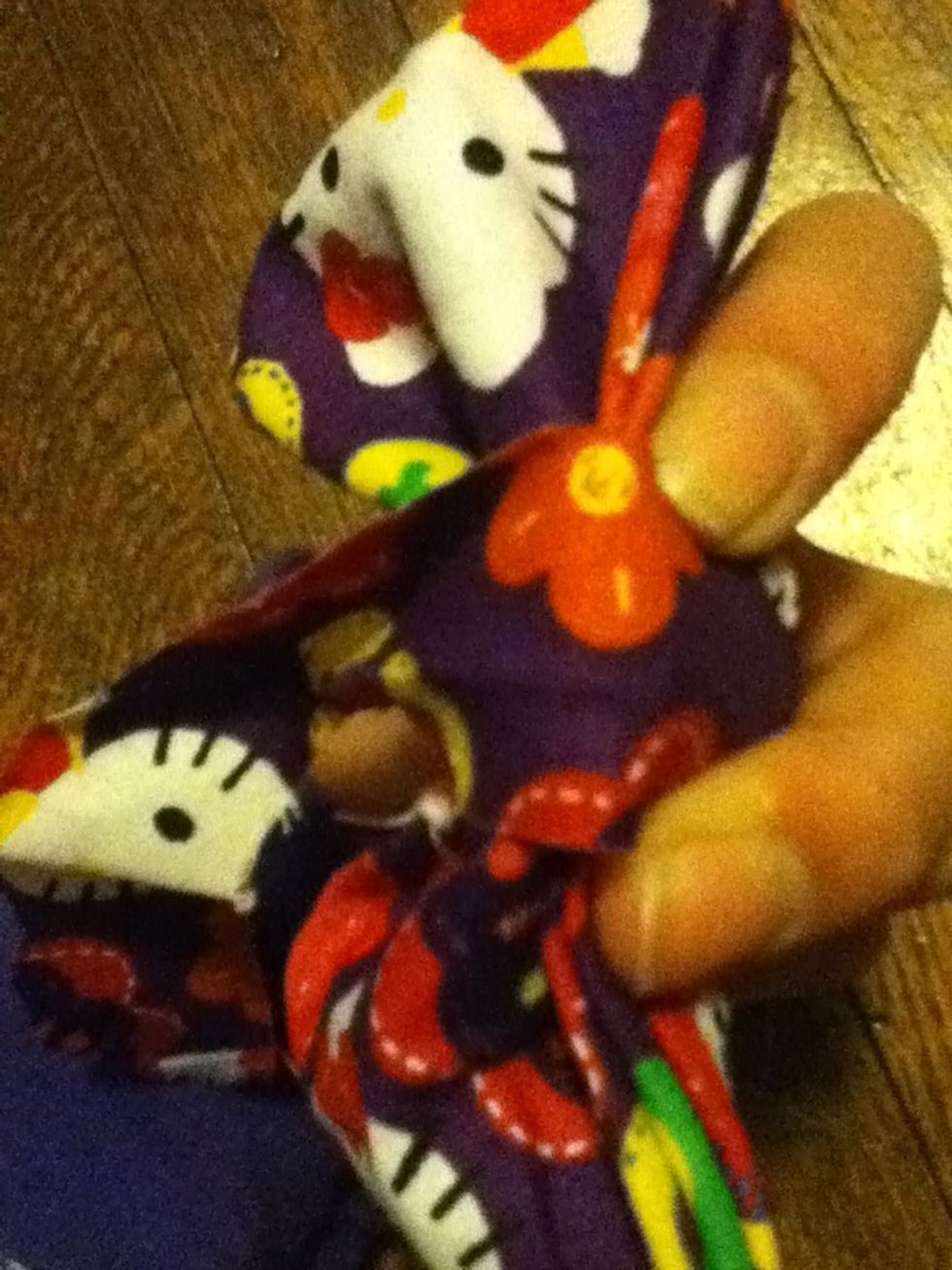 Place one end of  your long rectangle on the glue dot