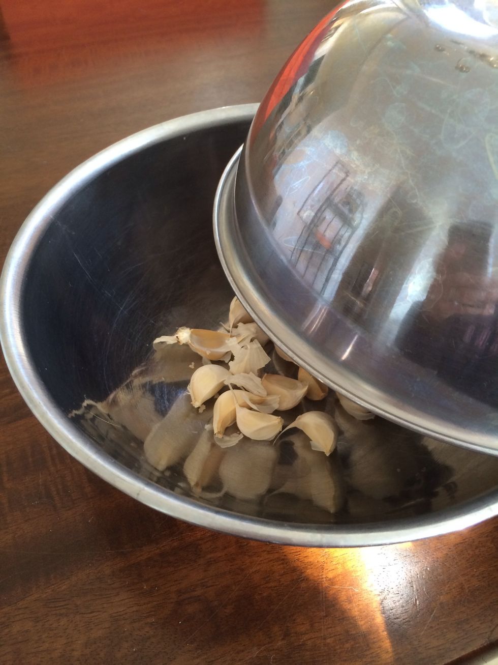 Place one of the bowls on top of the other and vigorously shake the contents inside for about 5-10 seconds.