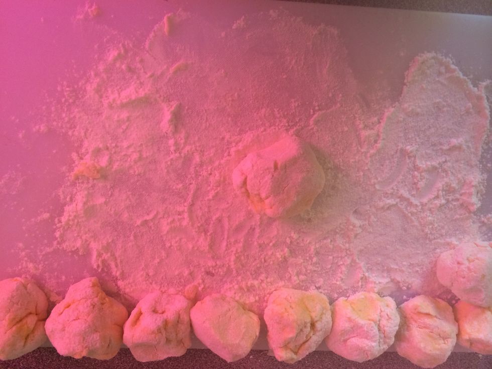 Place one of the mini balls of dough into the centre.