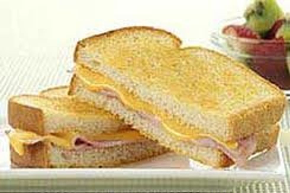 Place one piece of cheese on each piece of bread. www.5dollardinners.com