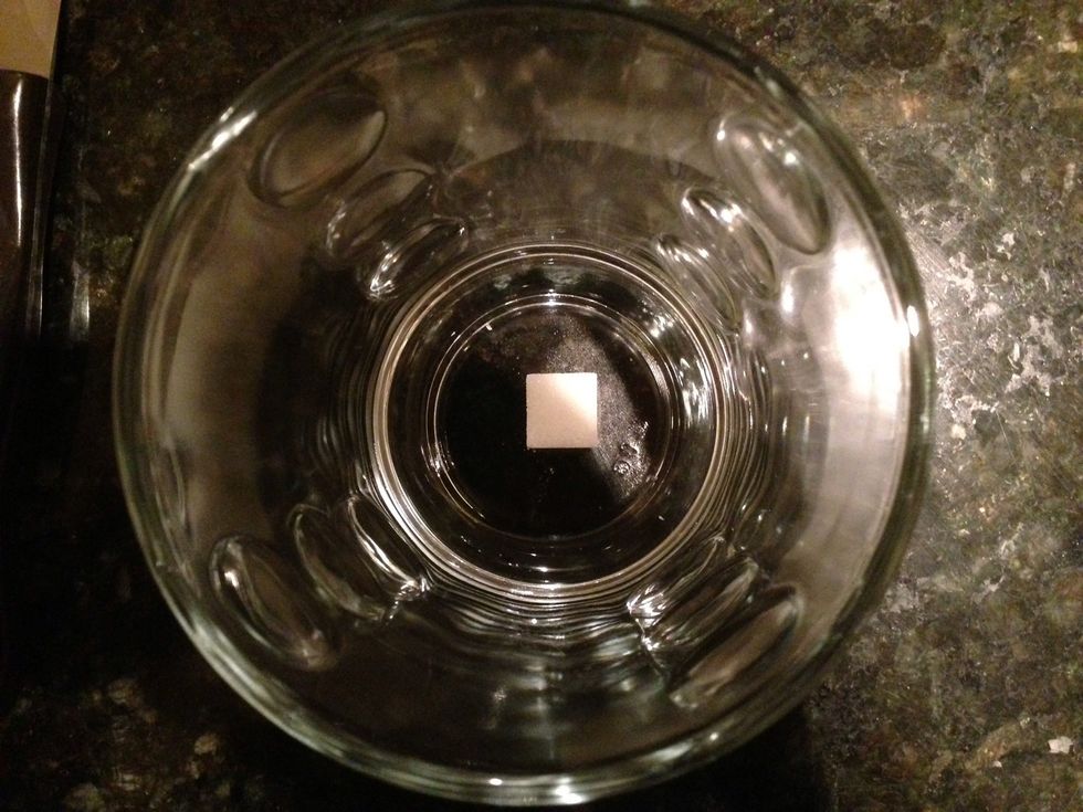 Place one sugar dot in a glass