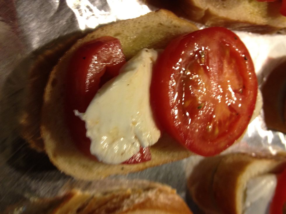 Place one tomato on top and one underneath so the cheese peeks through. (cheese may turn brown under the broiler if placed on top)