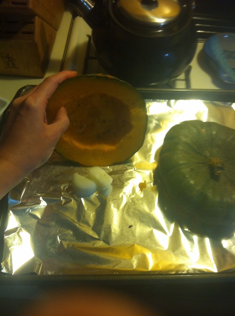 Place onion quarters under squash and bake for 35 mins