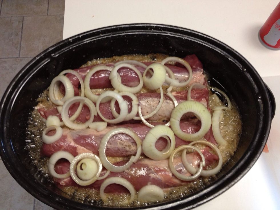 Place other 1/2 onion on top. Pour coke until meat is 1/2 way covered. **BBQ sauce on top is optional.** It can be added after you shred it when done. I added it after I shredded the pork.