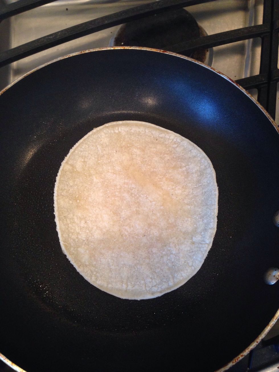 Place other tortilla on top