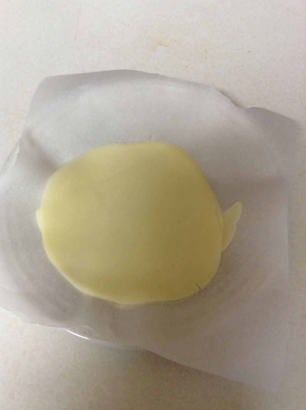 Place parchment paper on the plate then your cheese on top of it