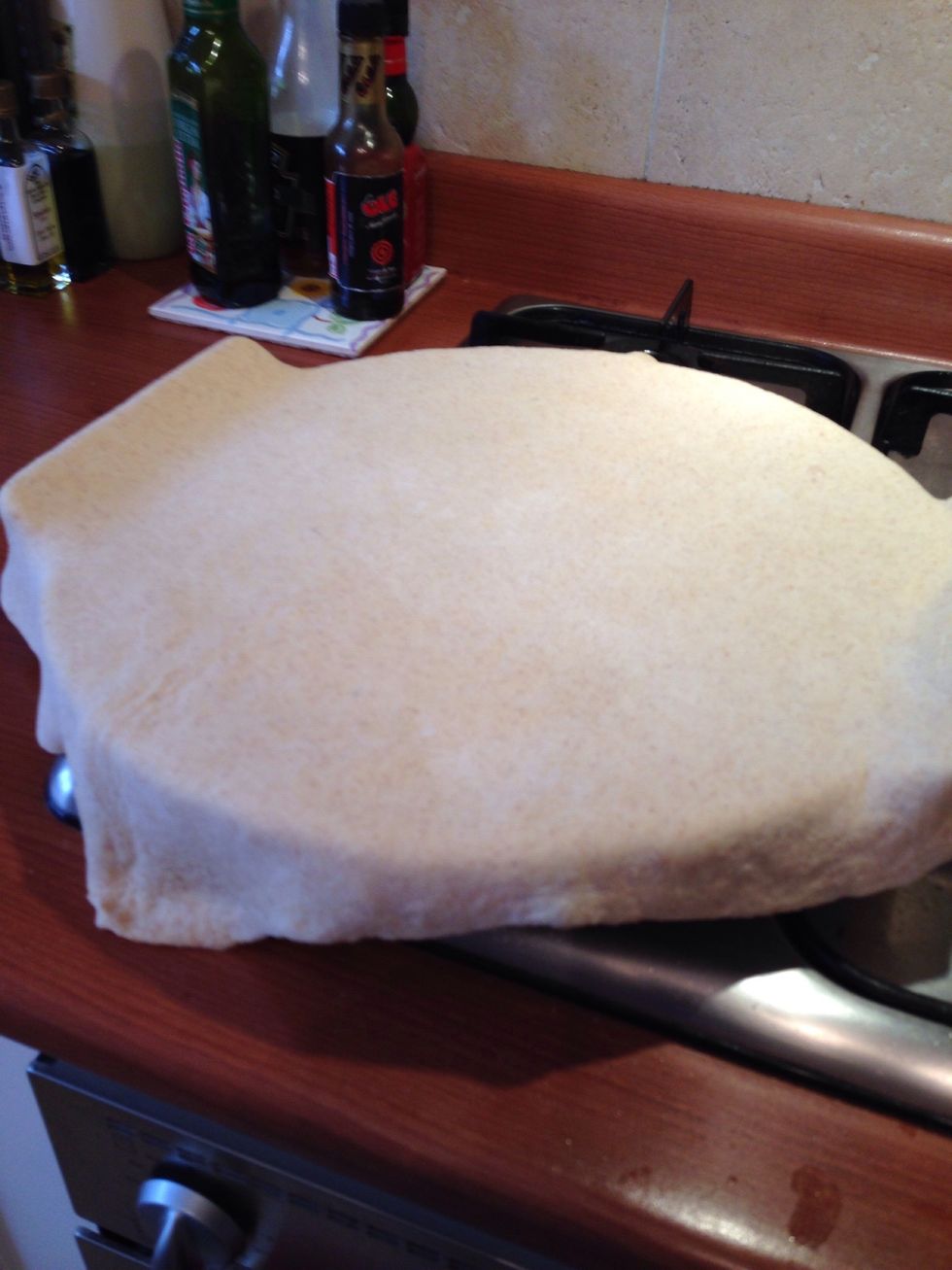 Place pizza dough onto pizza stone