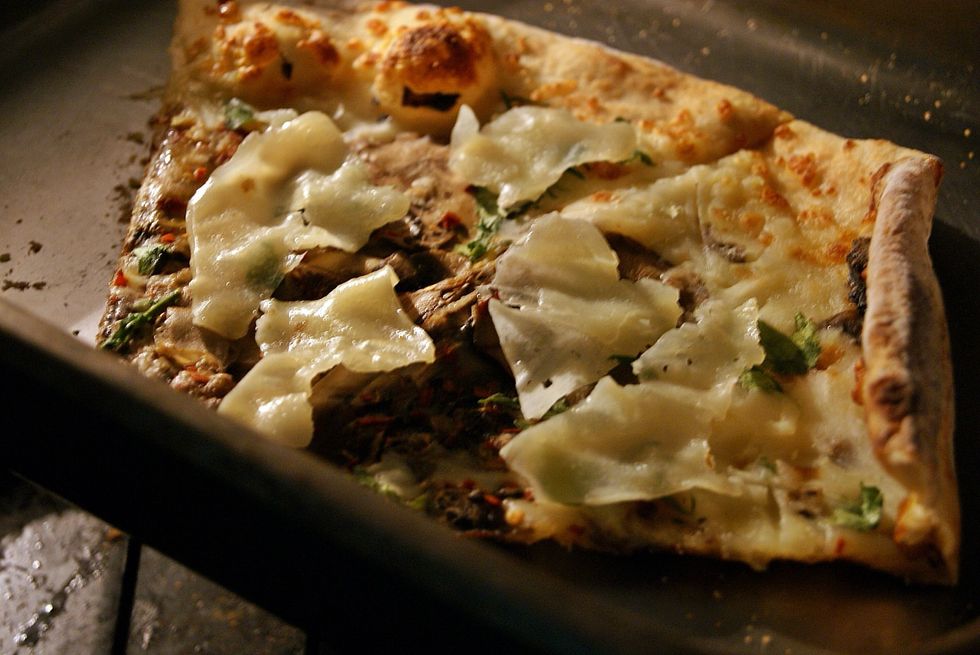 Place pizza in oven to warm.