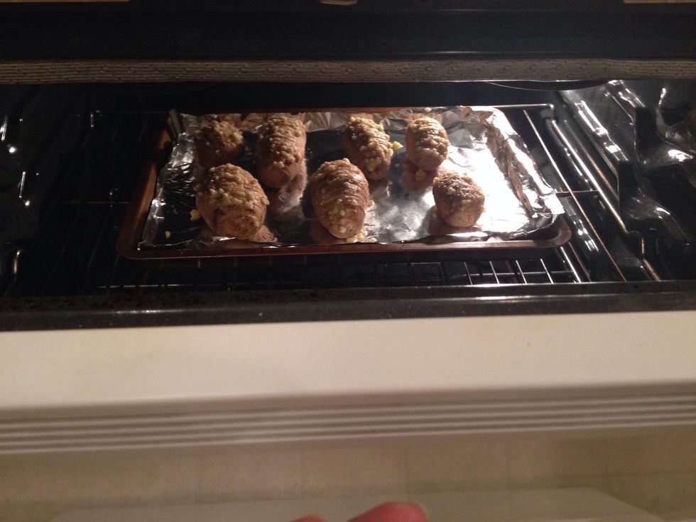 Place potatoes in the oven and bake for 45 minutes. If garlic browns too quickly, you can cover the top of potatoes with aluminum foil halfway through baking.