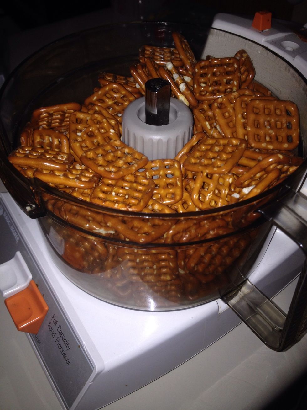 Place pretzels in a food processor.