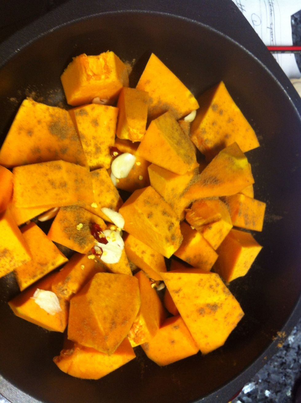 Place pumpkin in a pot and sprinkle with cumin, a small chilli chopped up and garlic. Place in stove on medium heat for 20-25 minutes or until pumpkin is soft