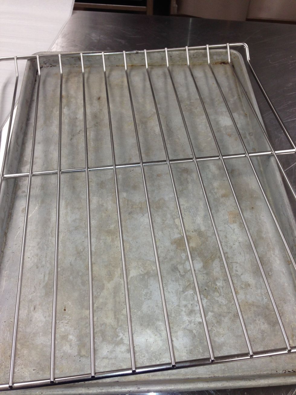 Place racks onto sheet pan liner or sheet pan.