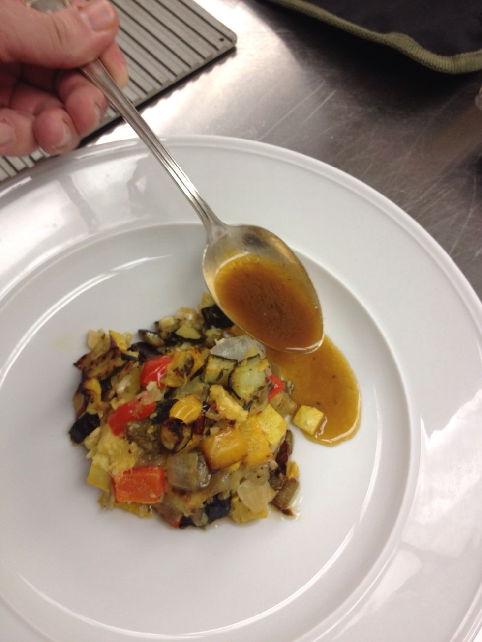Place ratatouille in the center of the plate, spoon sauce to surround it.