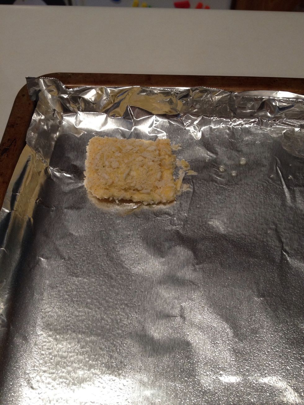 Place ravioli on aluminum foil. Continue with the rest of the ravioli.