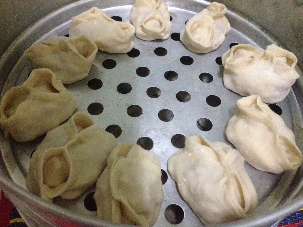 Place ready dumplings to steam layers and stuck them on steamer. Bring to boil for 40 minutes