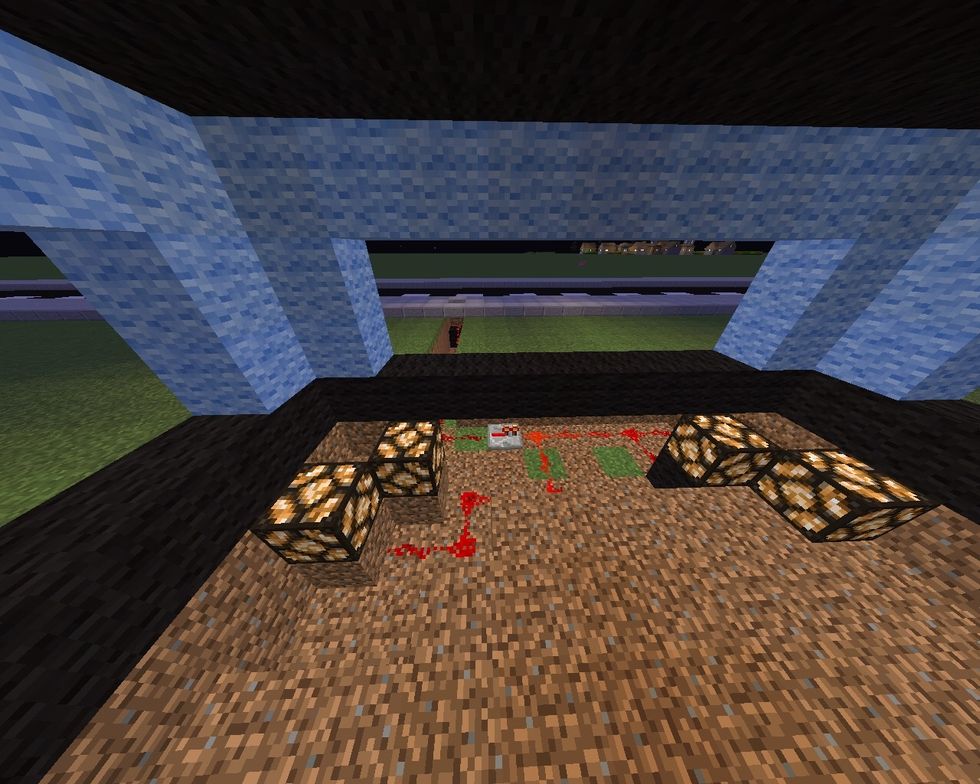 Place redstone from the night sensor to the redstone lamp. It will light on the night and turn of on the day