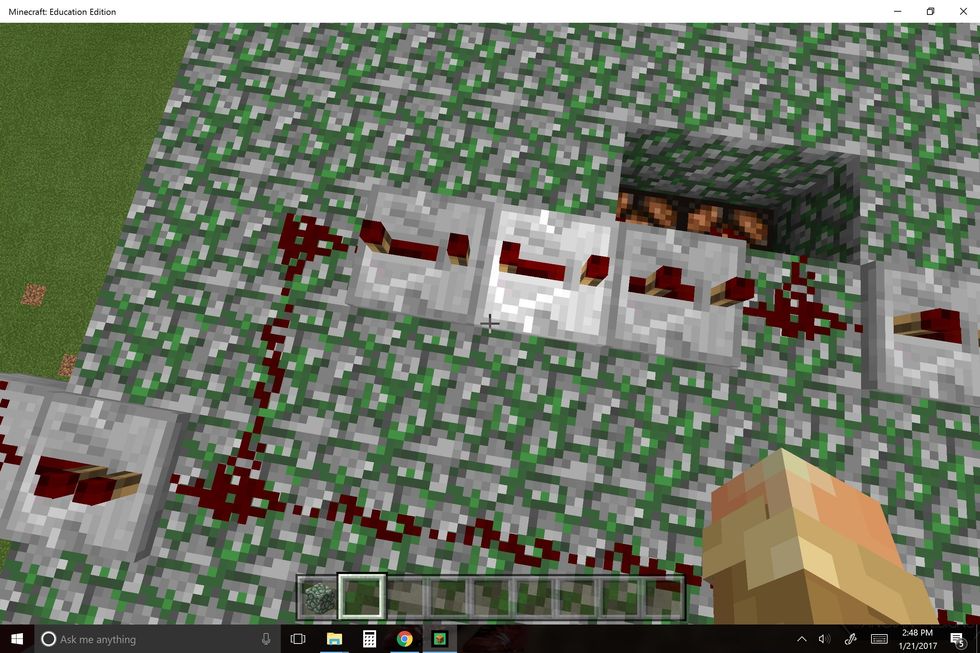 Place redstone lanterns in the roof and put three repeaters before the lanterns. Set two of the repeaters to 4 ticks (right clicking 4 times) and one for 3 ticks (if you want a 1 second interval).