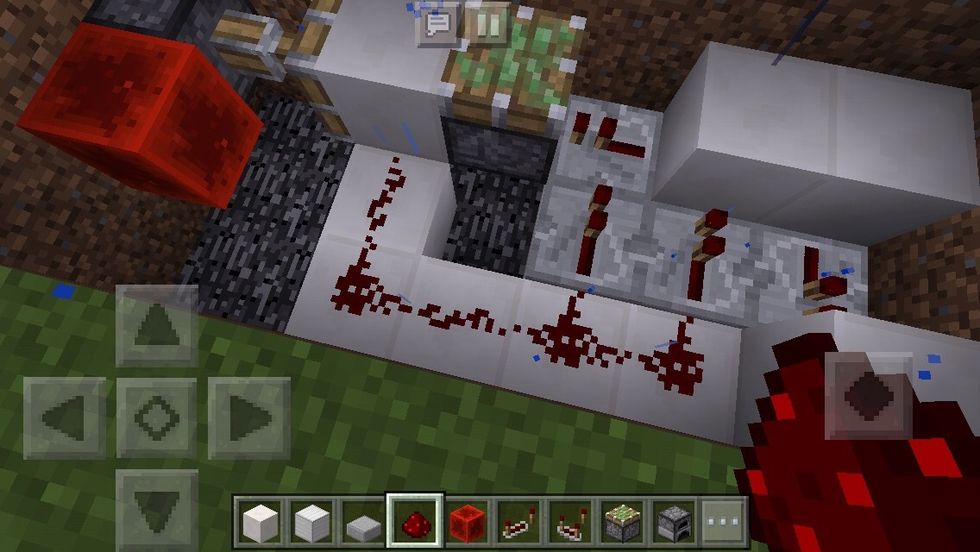 Place redstone on the quartz blocks as shown in the picture.