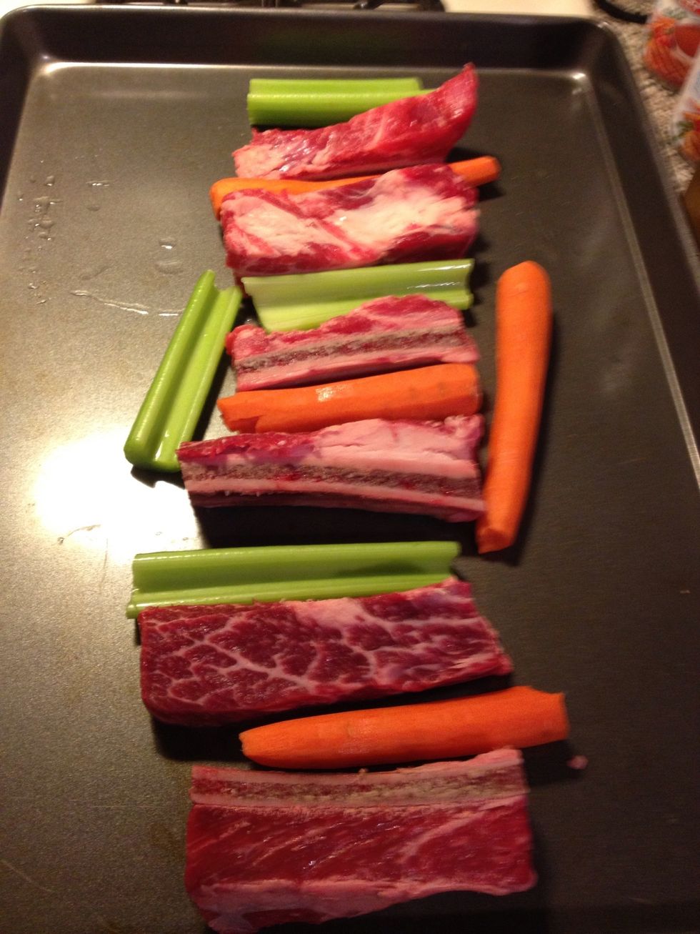 Place ribs, celery and carrots on a cookie sheet and roast in 425 degree oven for 15-20 mins.  Once cooked, place off to the side.