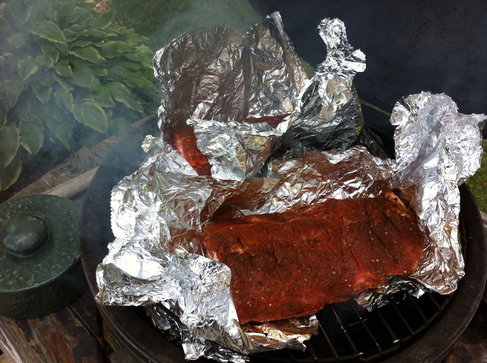 Place ribs onto grill with tin foil open for one hour. Keep temp around 200-225 degrees for the first hour.