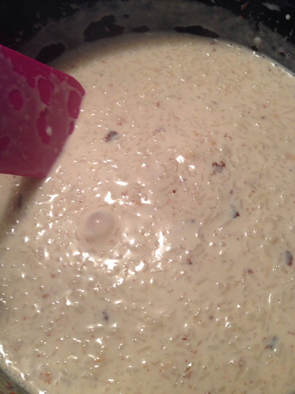 Place rice back in sauce pan and stir in milks. Continue to stir the mixture and let it boil. Then turn the heat to low setting and continue to stir it until all the mixture thickens.