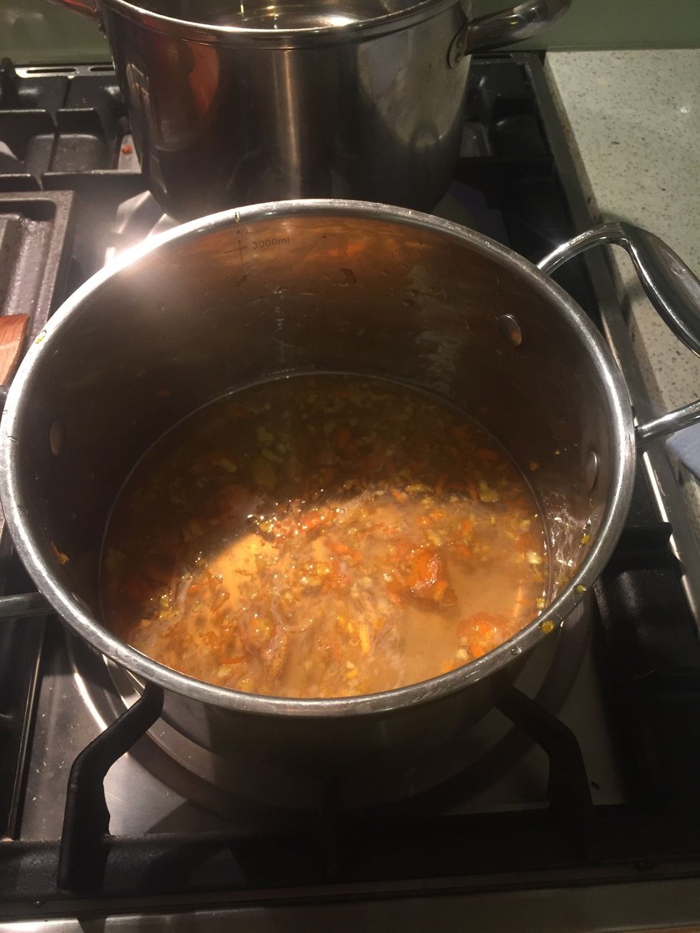 Place rind and honey into a saucepan and add 1/2 cup of cold water stir over low heat until combined for 5 minutes until syrup has reduced slightly then remove from heat and set aside.