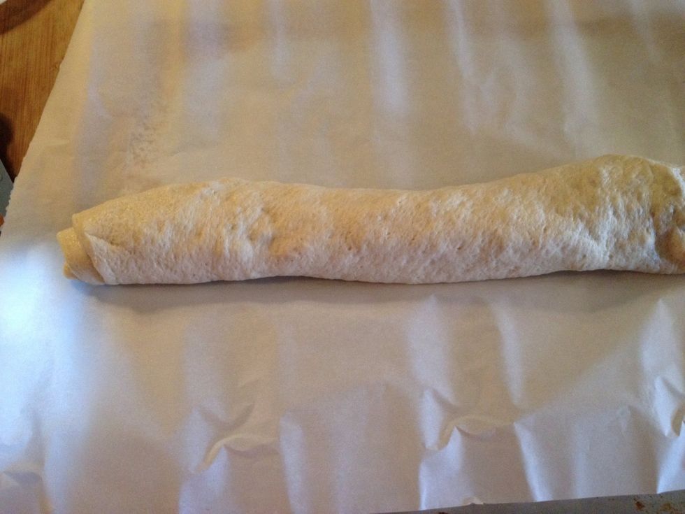 Place rolled log on parchment paper, seam side down