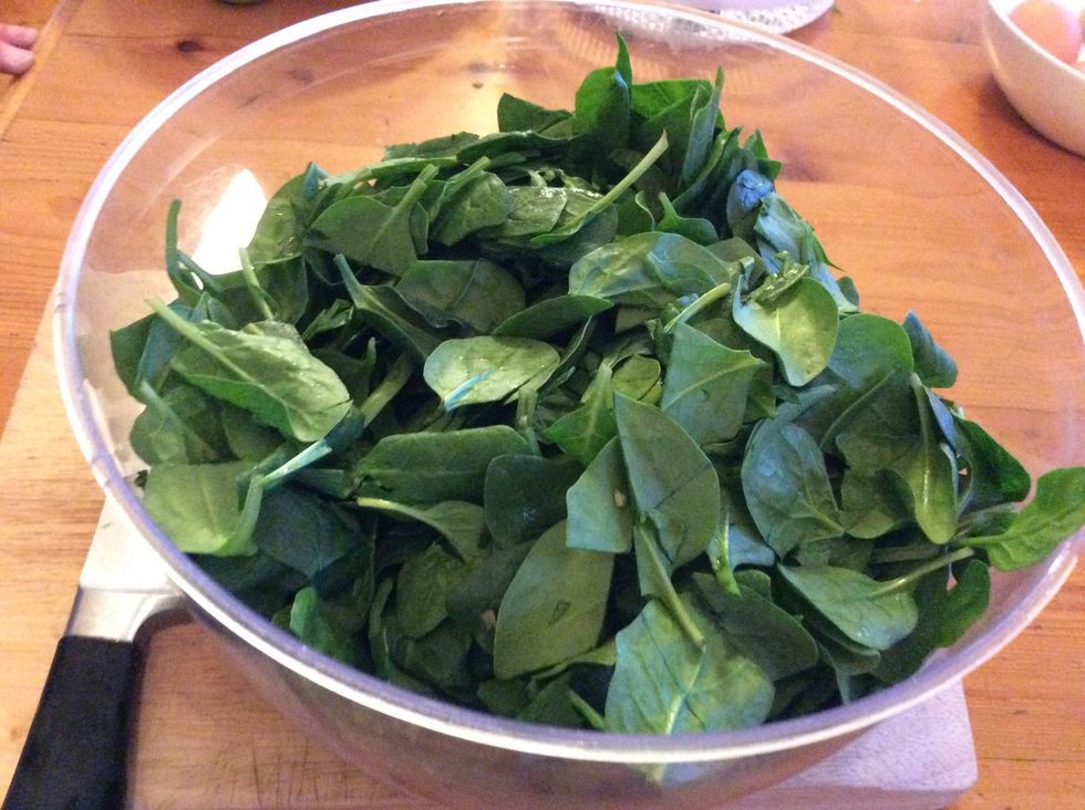 Place roughly chopped spinach leaves into a separate bowl than the one you need for the cheeses, and put aside.