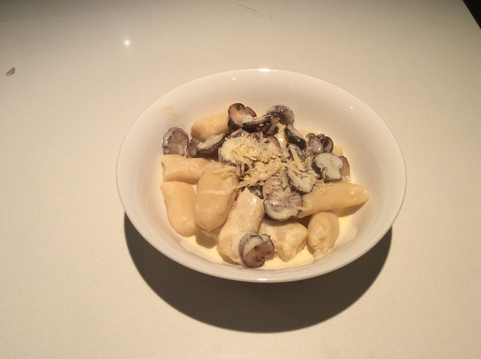 Place sauce and mushrooms on Gnocchi with Parmesan on top.