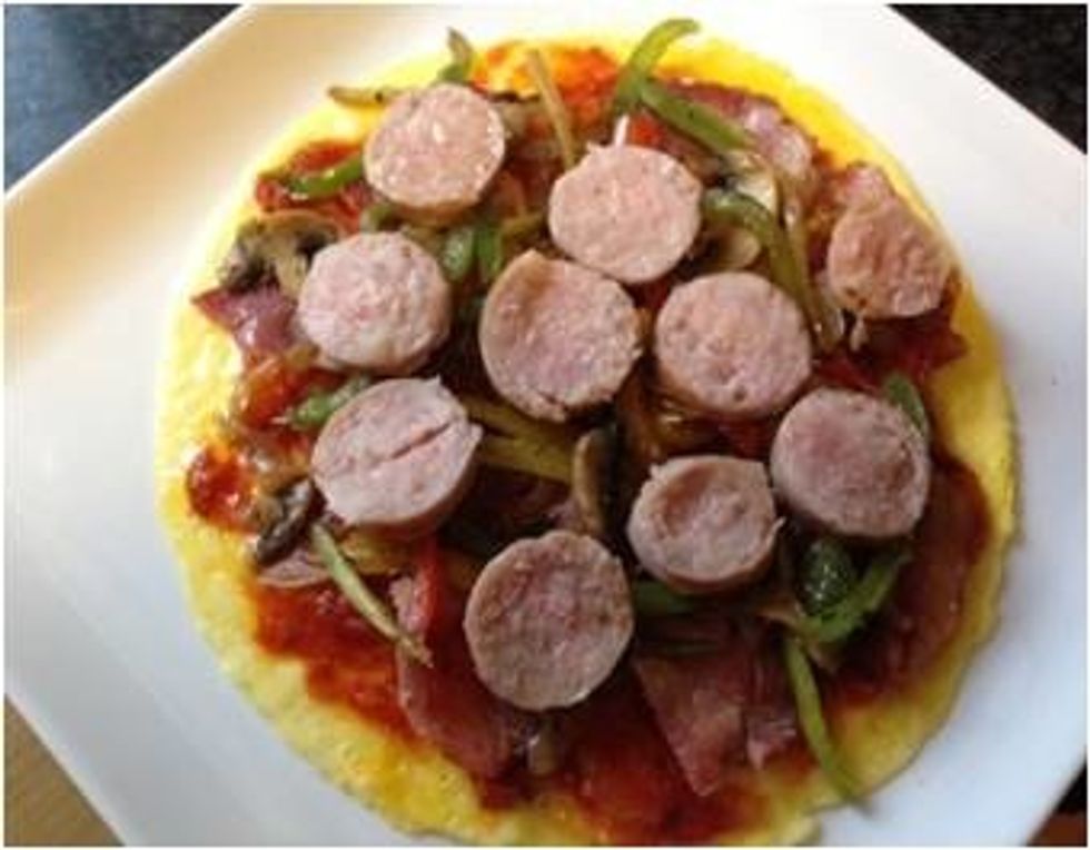 Place sausage slices on top of stir fry. Sausages may be cut length wise
