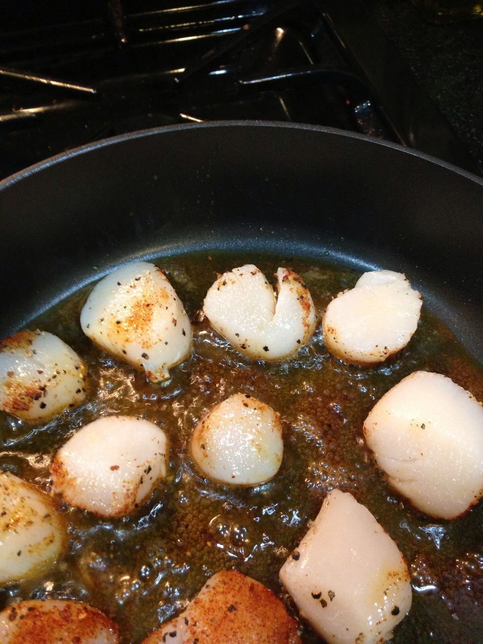 Place scallops in the hot skillet season side down.