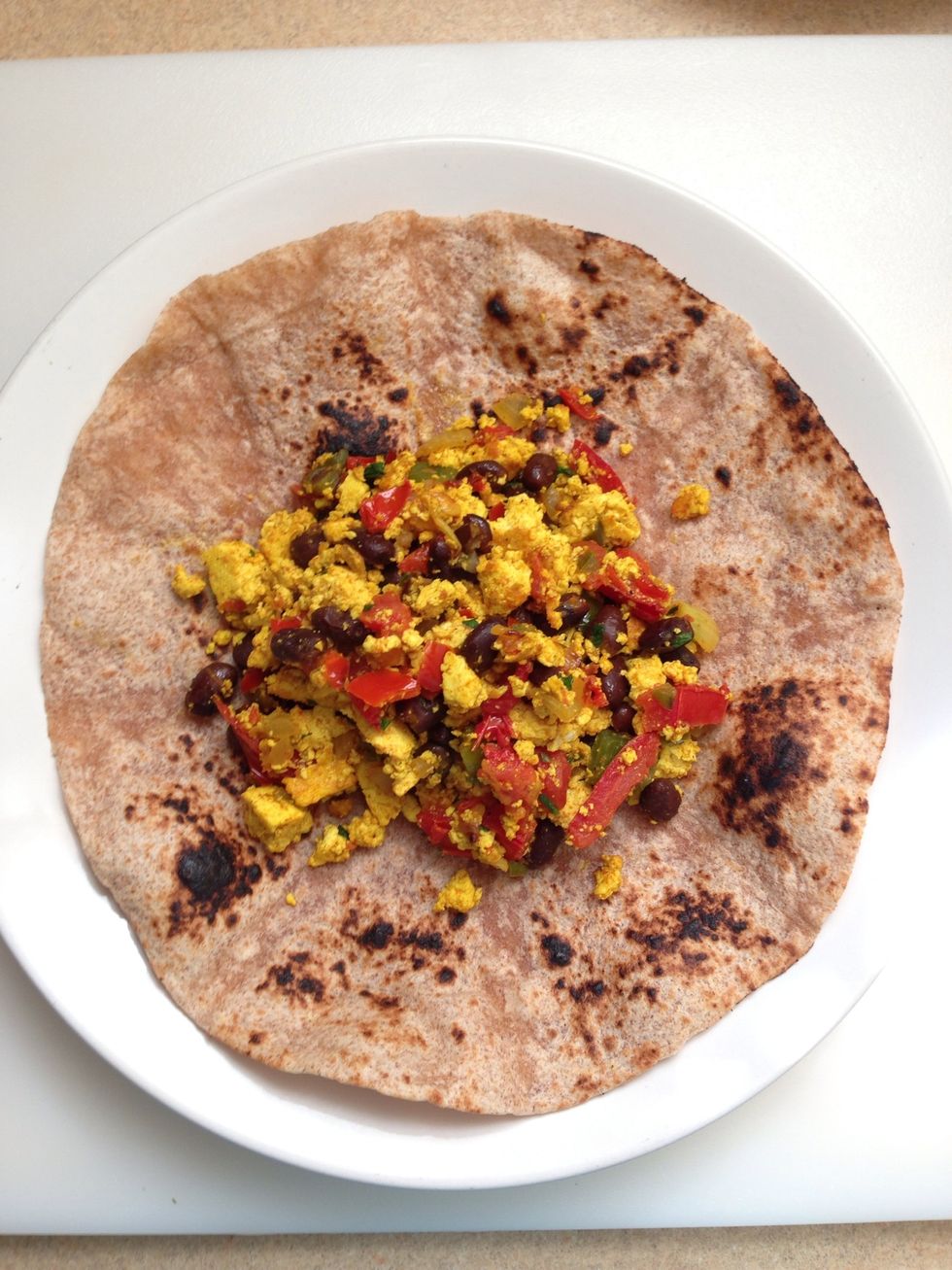 Place scramble in center of tortilla.