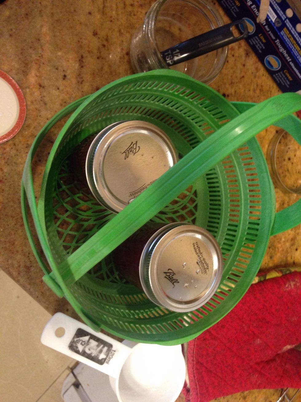 Place sealed jars into basket & place in ur stockpot/canner w/ boiling water.