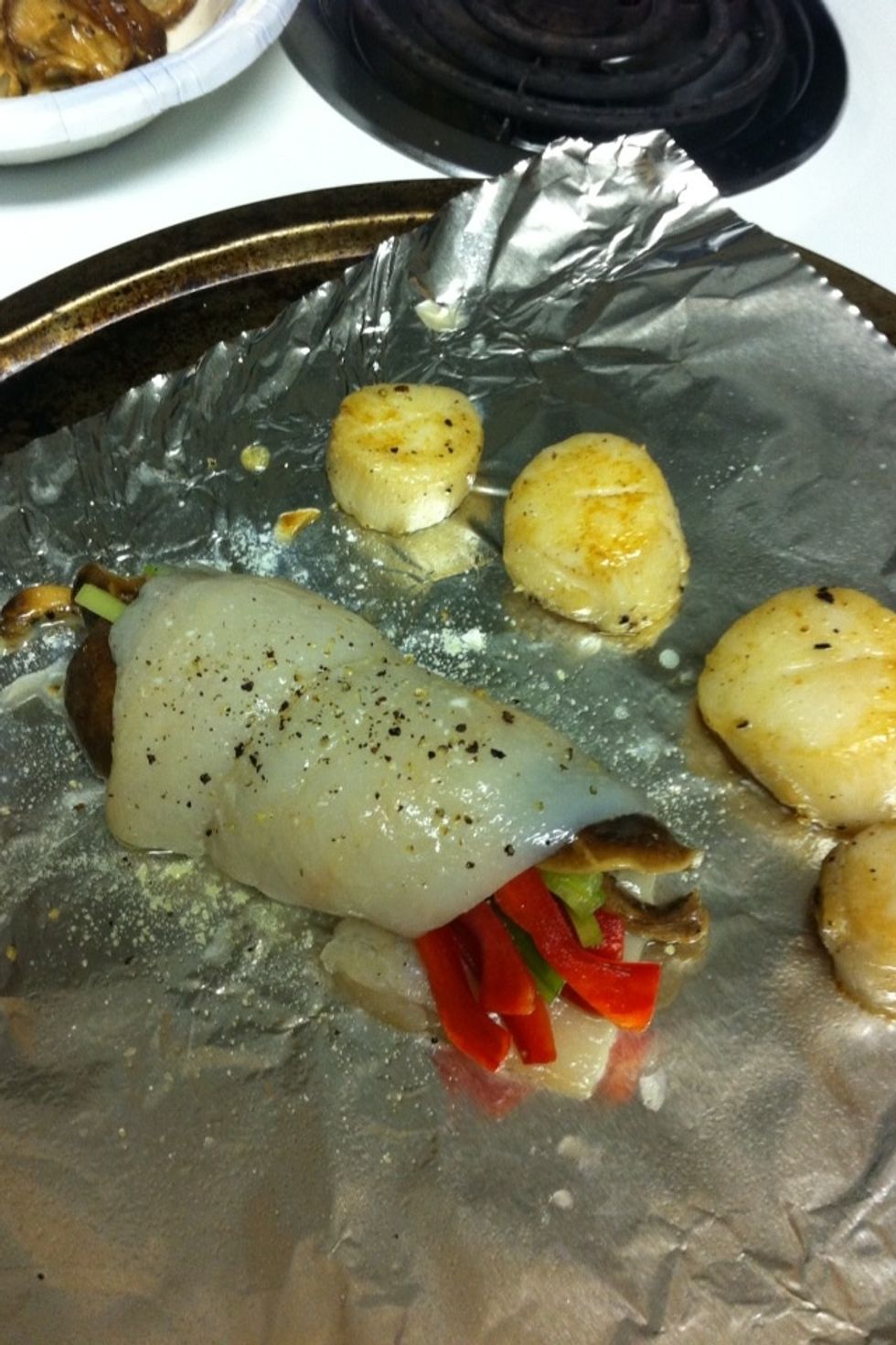 Place seared scallops on tray next to fish.  Place tray in oven for approx 10-12 minutes.  Check to make sure thickest part of fish is cooked thoroughly.