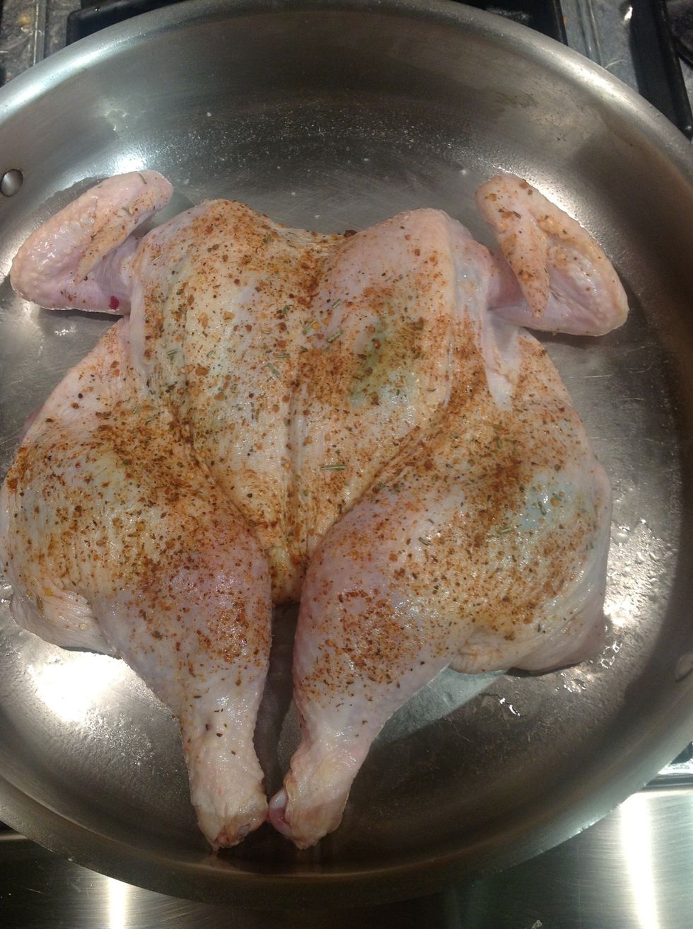 Place seasoned chicken breast side up centered in large hot saut\u00e9 pan.