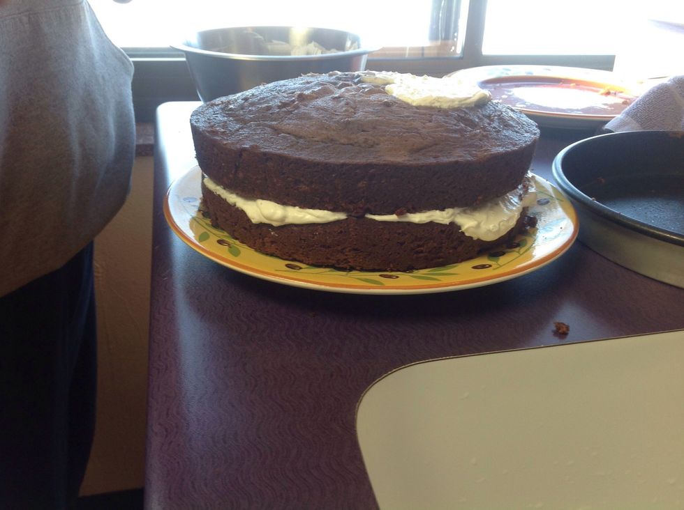 Place second cake on top of icing