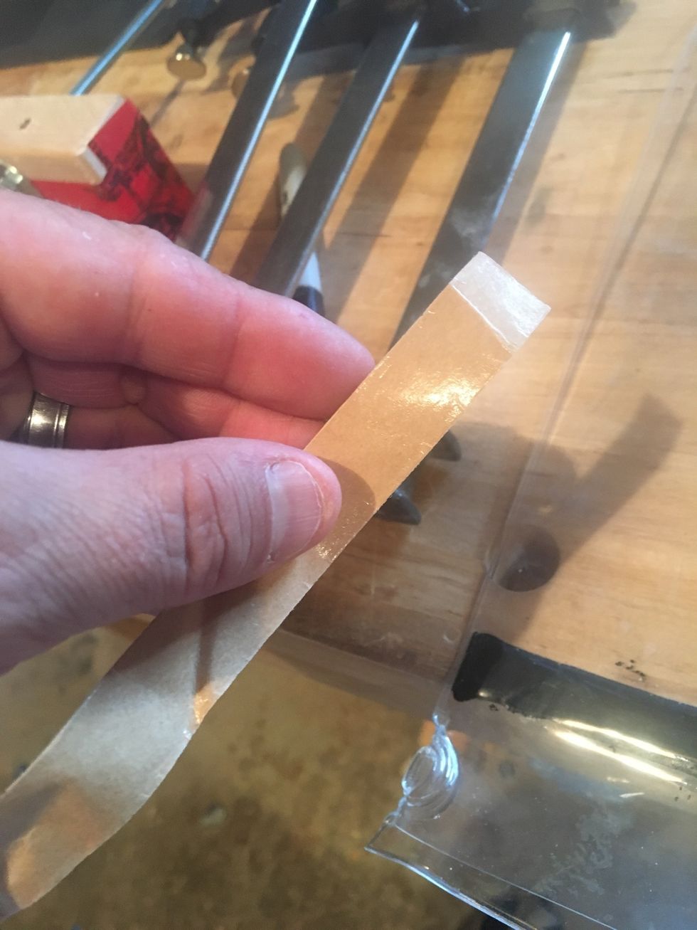 Place shiny side of sealing tape cover on sealing tape.