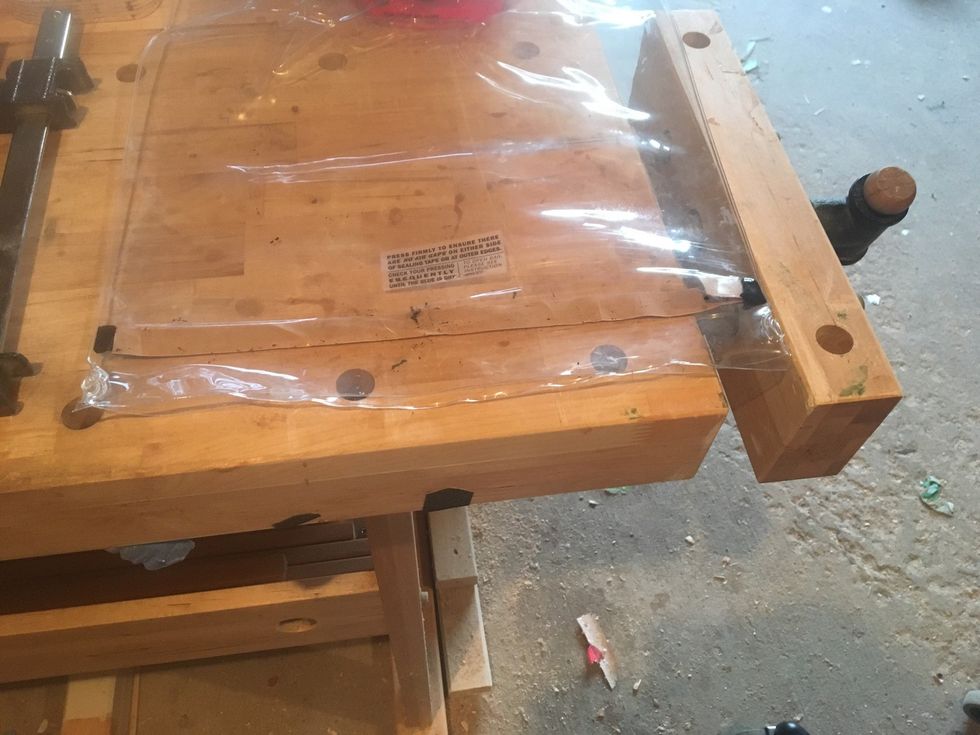 Place shiny side of sealing tape cover on sealing tape.