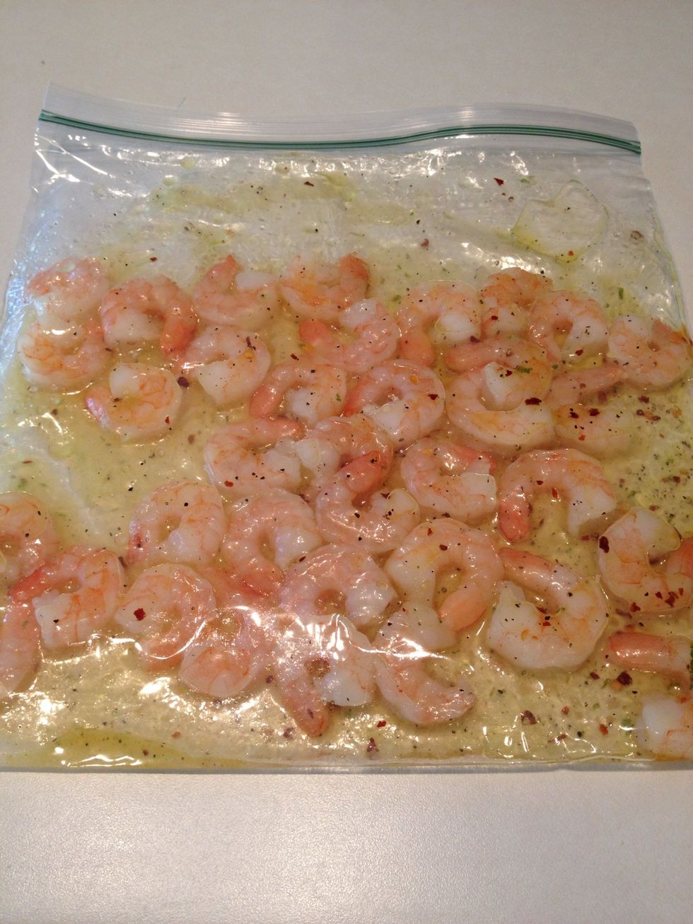 Place shrimp and sauce in a ziplock bag. Zip tightly and shake well. Place in fridge at least 30 minutes to marinate.