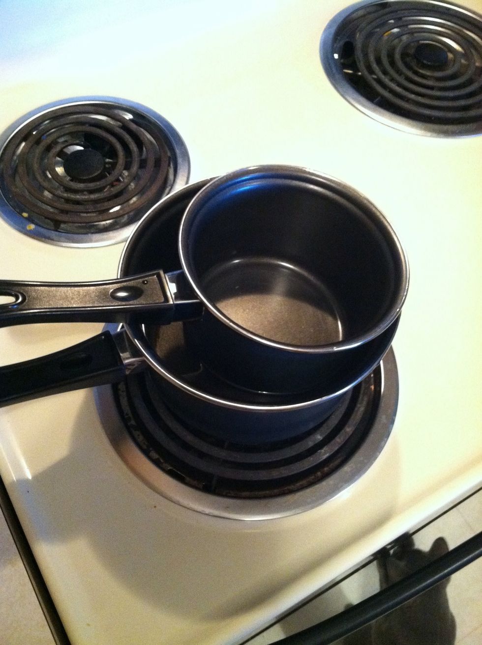 Place smaller empty saucepan inside.