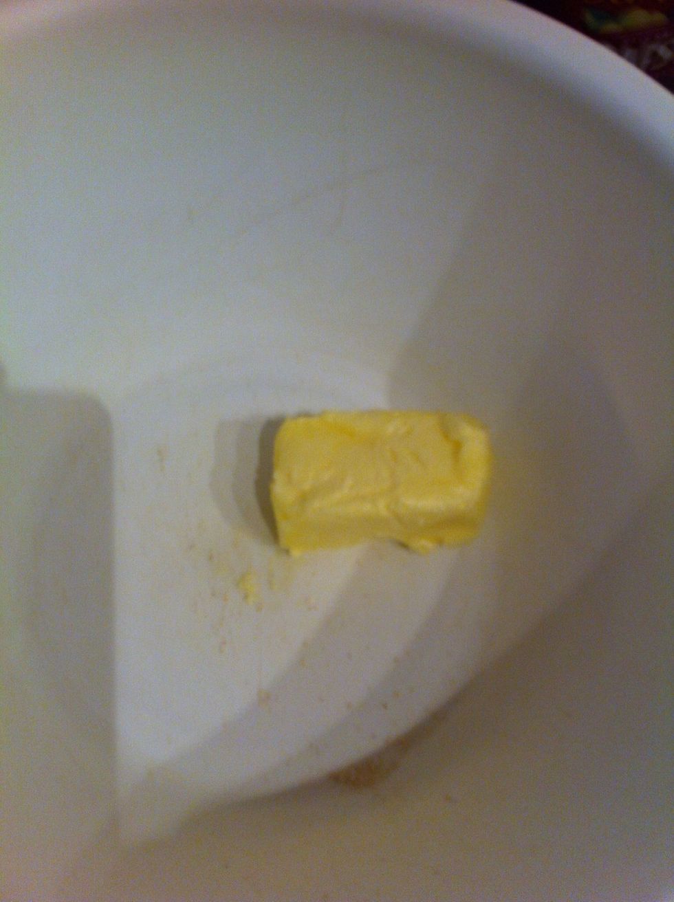 Place softened butter in a large bowl