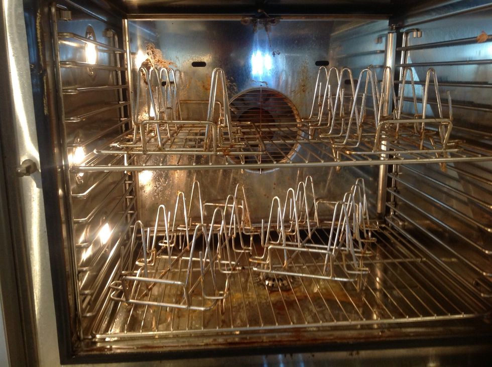 Place soiled Blodgett Rotisserie Racks in oven