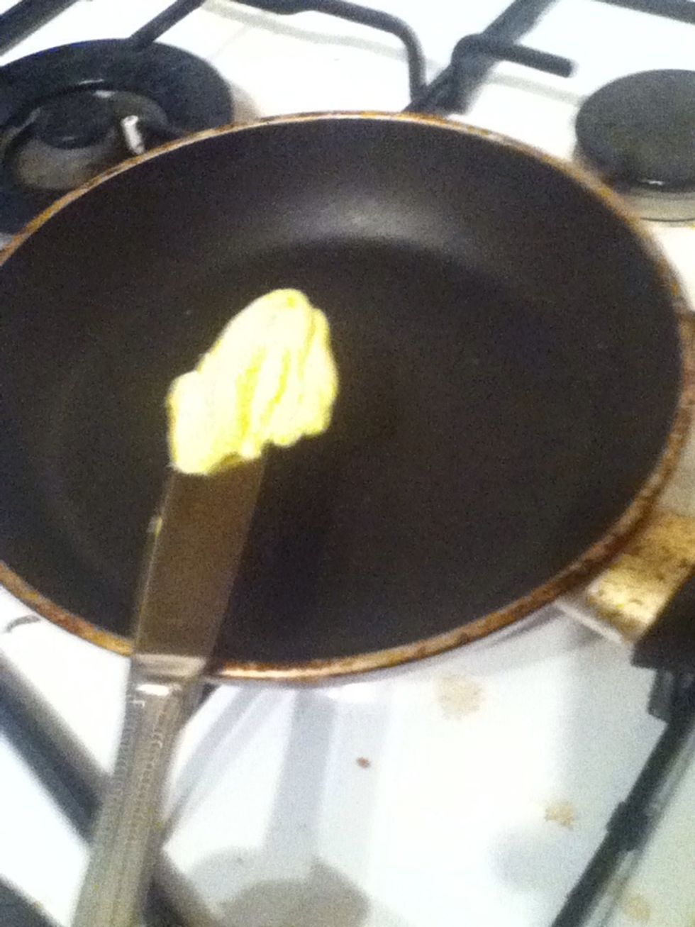 Place some butter in the pan of you don't want butter use oil