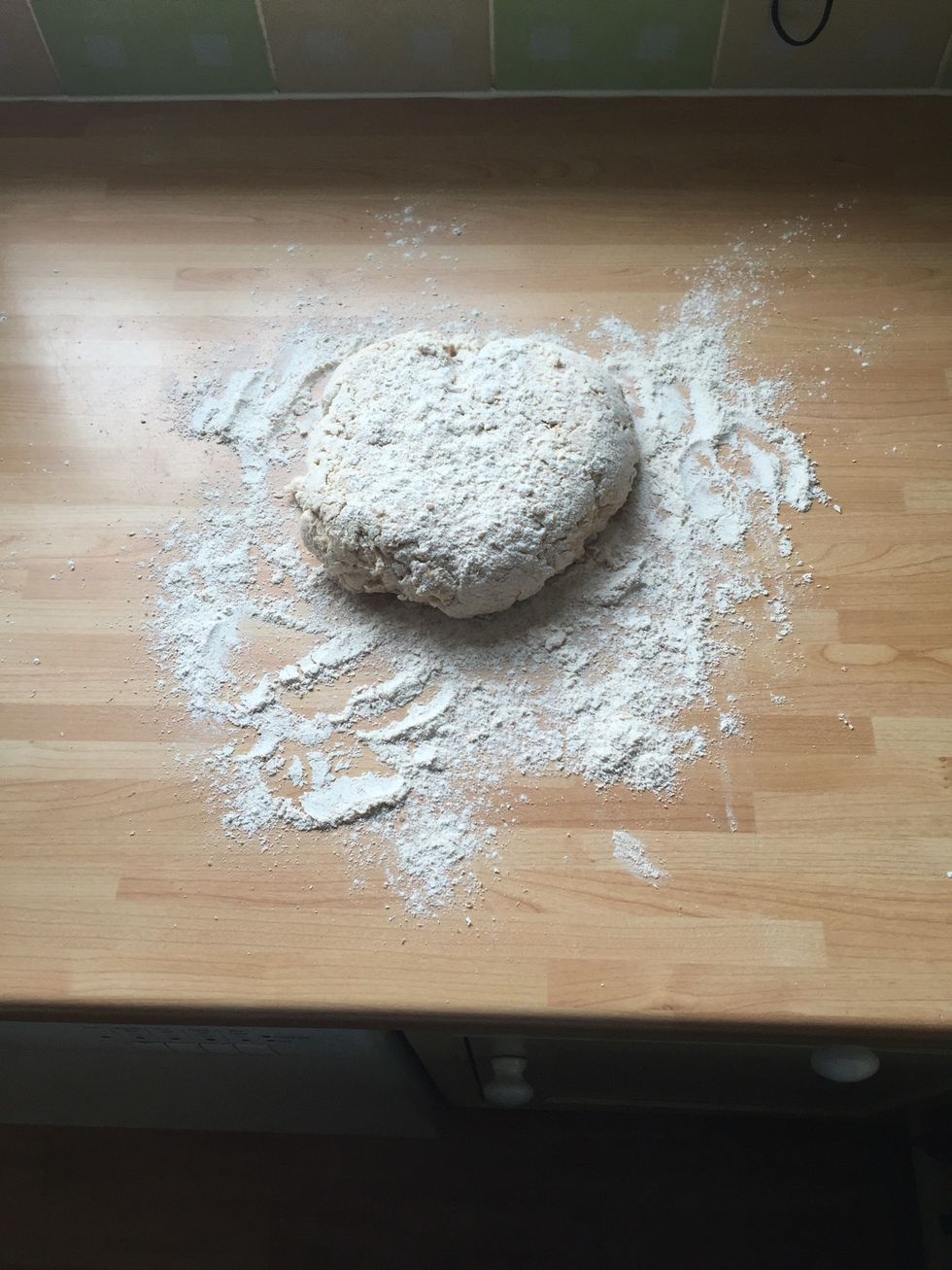 Place some flour on the work surface and place ur dough on top